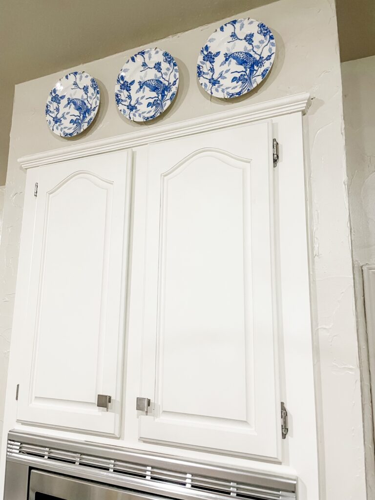 https://savvyinthesuburbs.com/wp-content/uploads/2023/04/BLUE-AND-WHITE-PLATES-ON-WALL-768x1024.jpg
